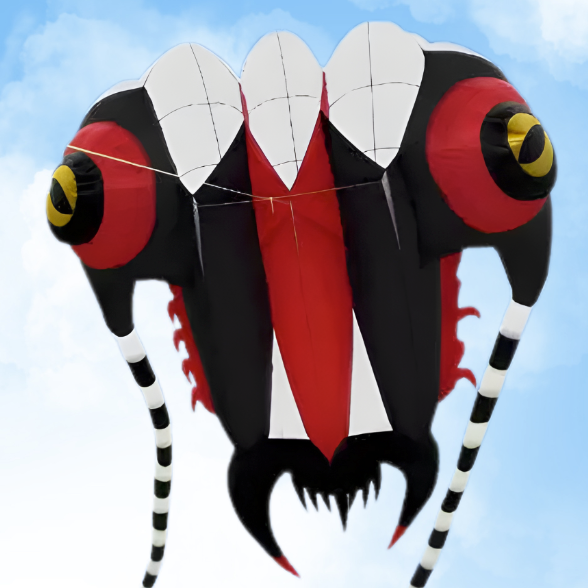 Kite shaped like a stylized insect or trilobite with red, black, and white colors against a blue sky.