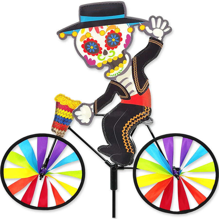 Colorful bicycle spinner with a decorative figure on a white background