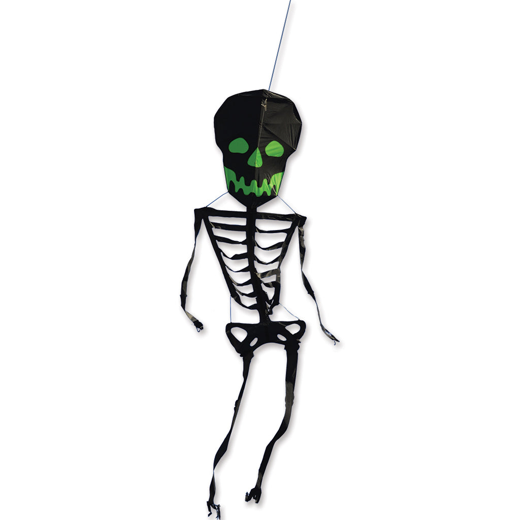 Skeletal shaped kite with green eyes on a white background