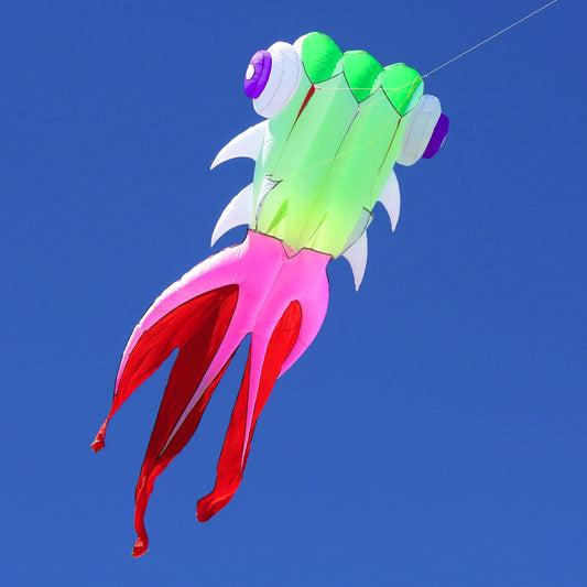 Colorful kite shaped like a fish against a clear blue sky
