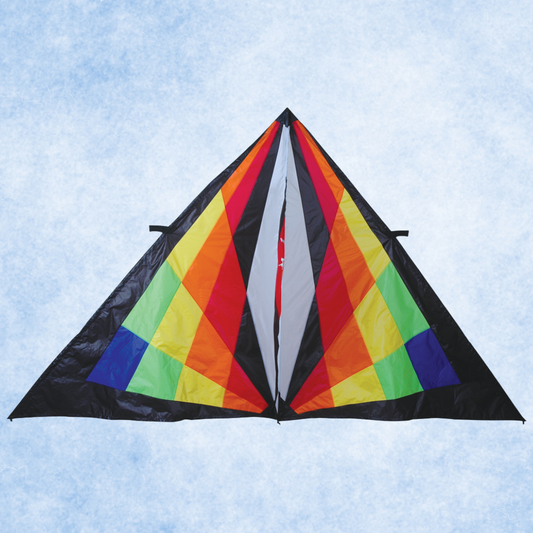 Colorful delta-shaped kite against a light blue sky