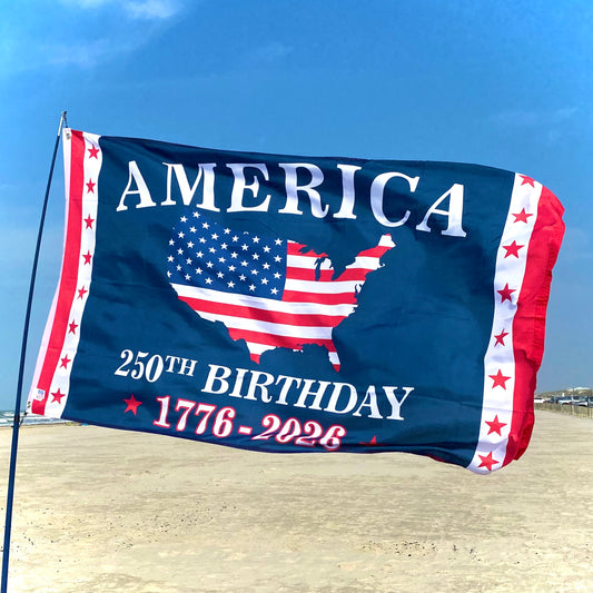 Flag celebrating America's 250th birthday with a map of the United States on a beach.