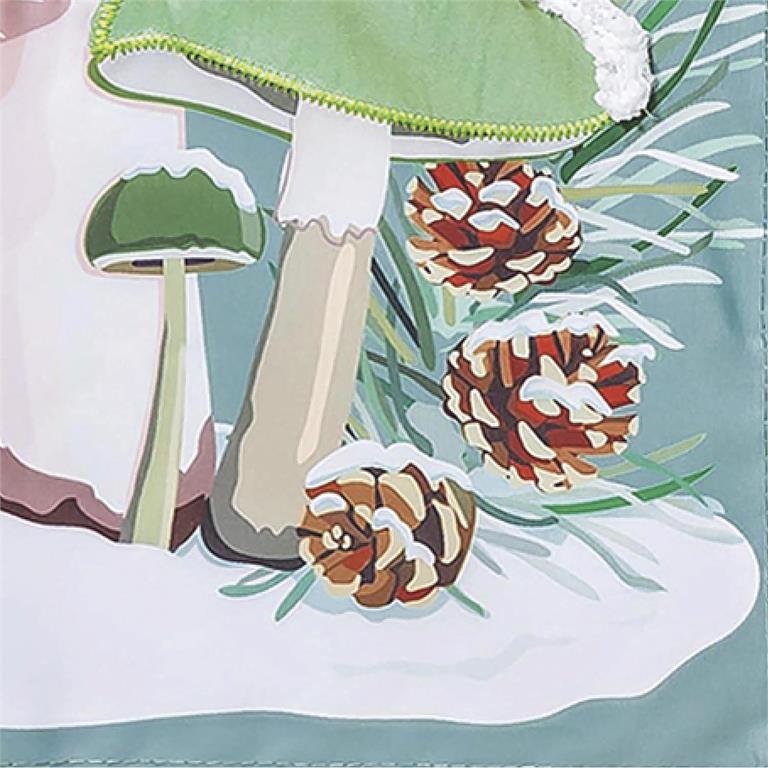 Close-up of a fabric with mushroom and pine cone pattern on a light blue background