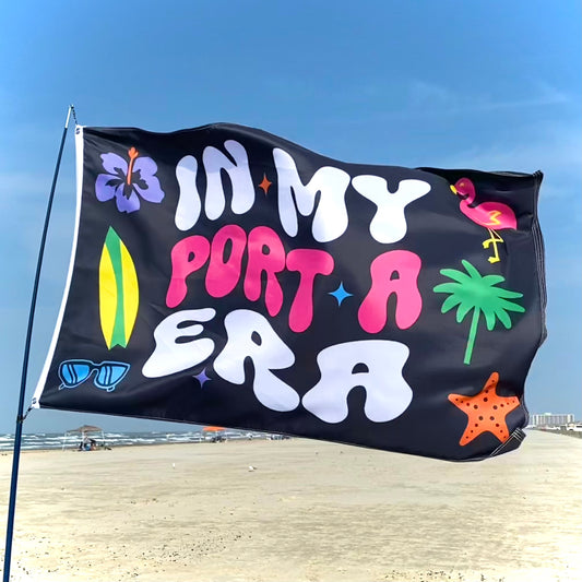 Flag with colorful text and beach-themed graphics on a beach background