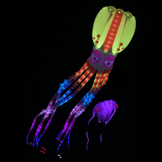 Colorful jellyfish-shaped kite with LED lights on a black background