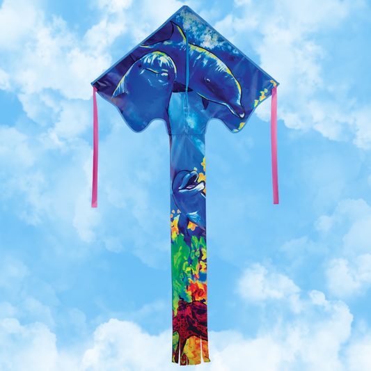 Colorful kite with dolphin design against a blue sky