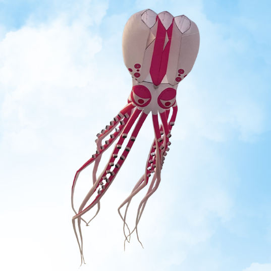 Pink octopus-shaped kite flying against a blue sky with white clouds