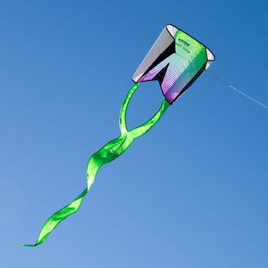 Green kite with a colorful tail against a clear blue sky