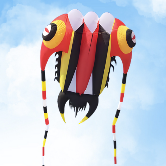 Colorful kite shaped like a trilobite against a blue sky