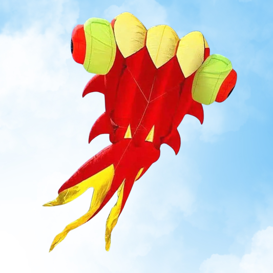 Colorful kite resembling a fish against a blue sky