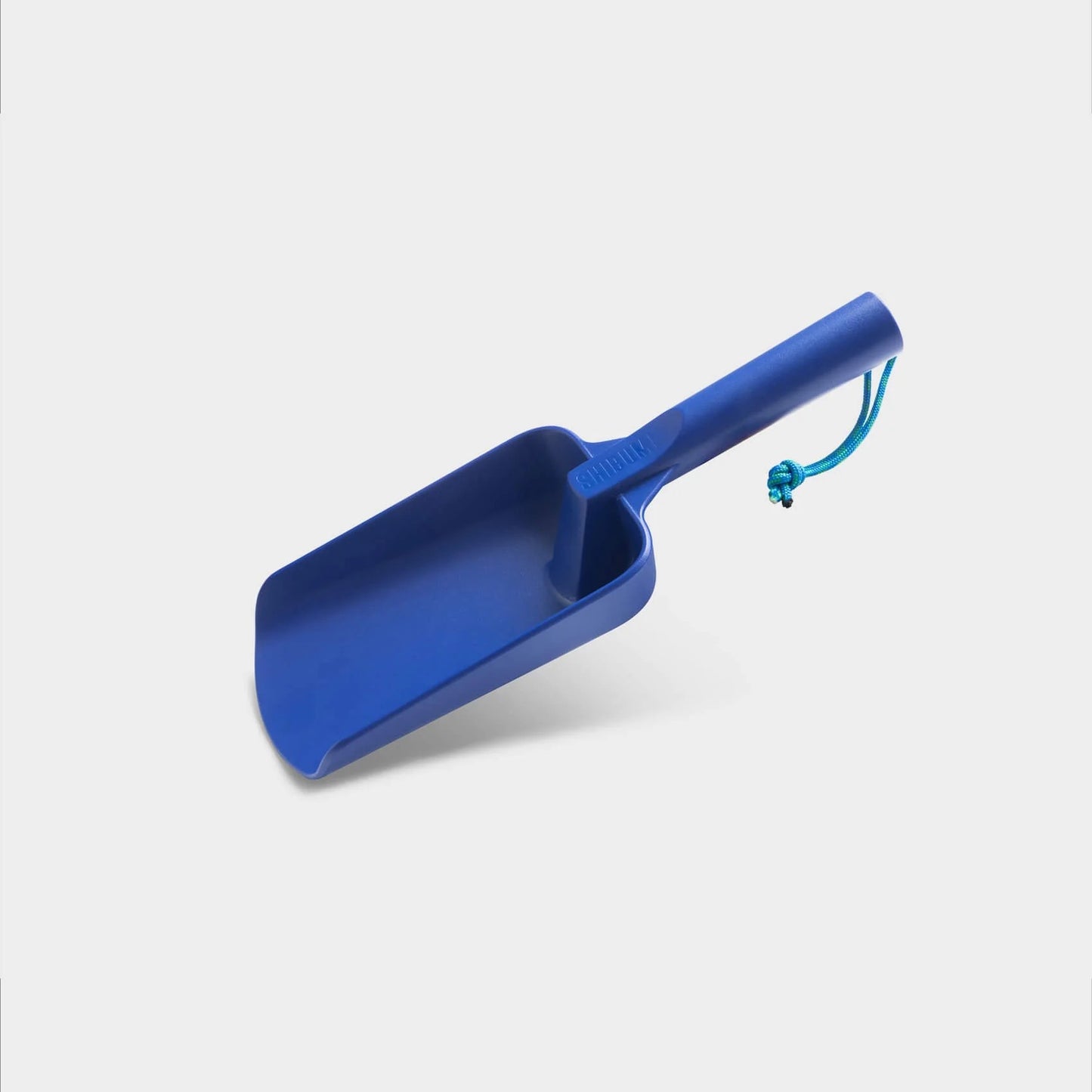 Blue plastic scoop on a white background