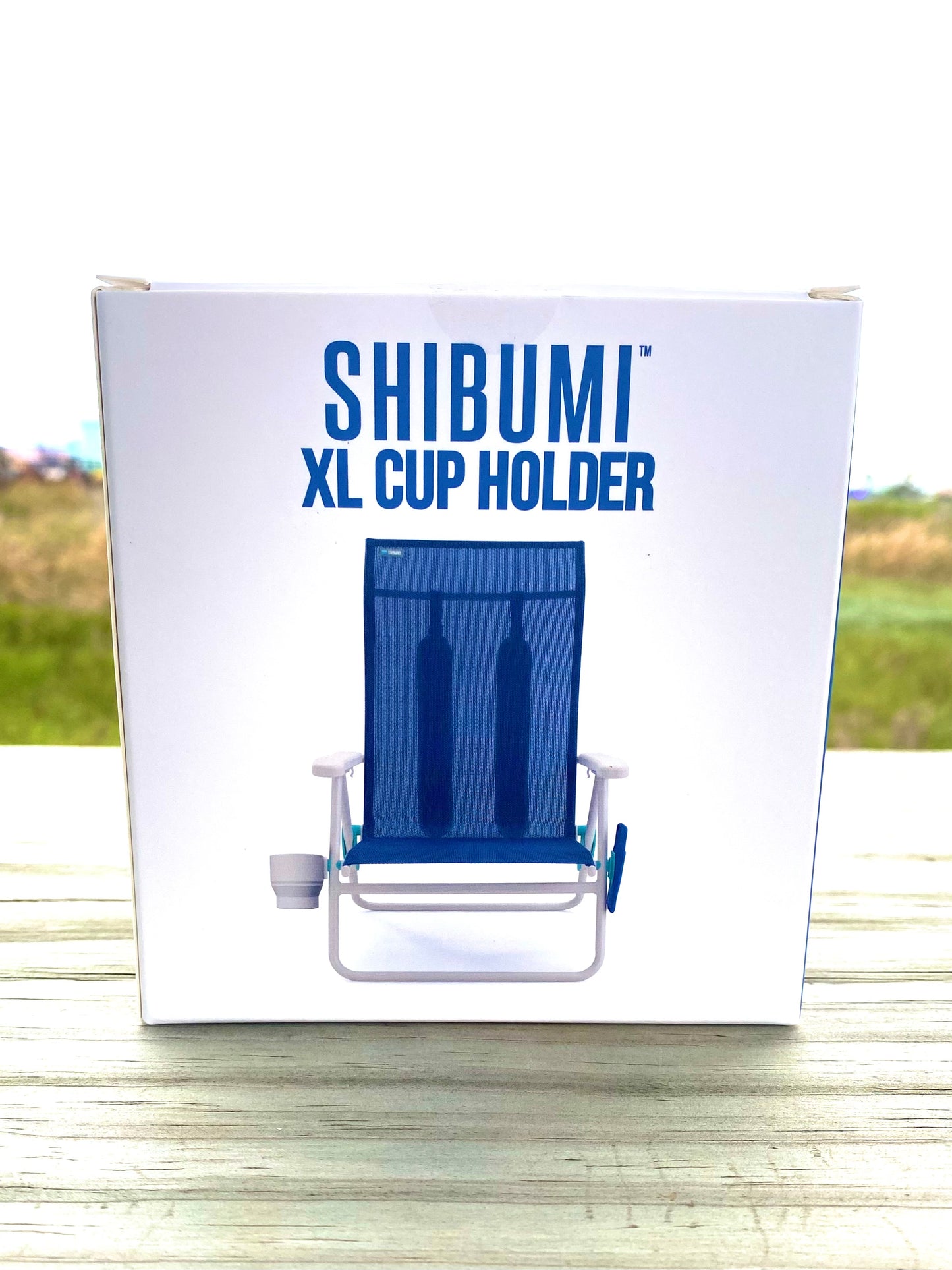 Shibumi XL Cup Holder packaging with a beach chair illustration on a white background