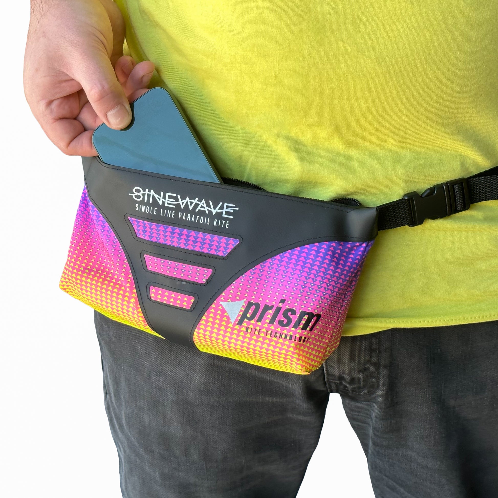 Person wearing a colorful fanny pack with 'Sinewave' and 'prism' branding.