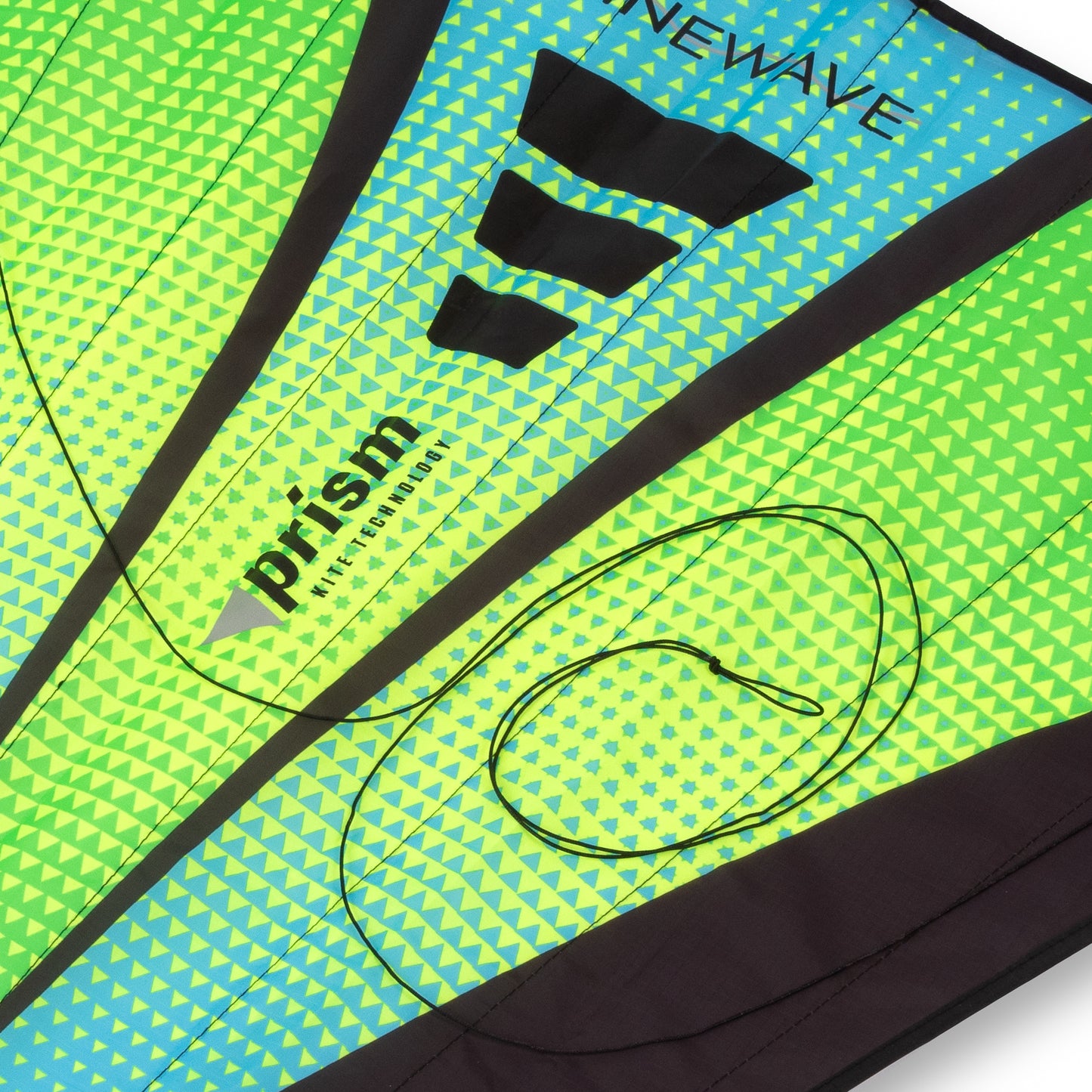 Close-up of a green and blue kite with 'Newave' and 'Prism' branding.