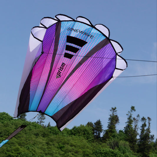 Colorful kite with 'Sinewave' branding against a clear blue sky