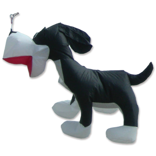An inflatable dog-shaped kite with a black body, white paws and muzzle, and a red tongue, shown on a white background with a metal clasp at the top.