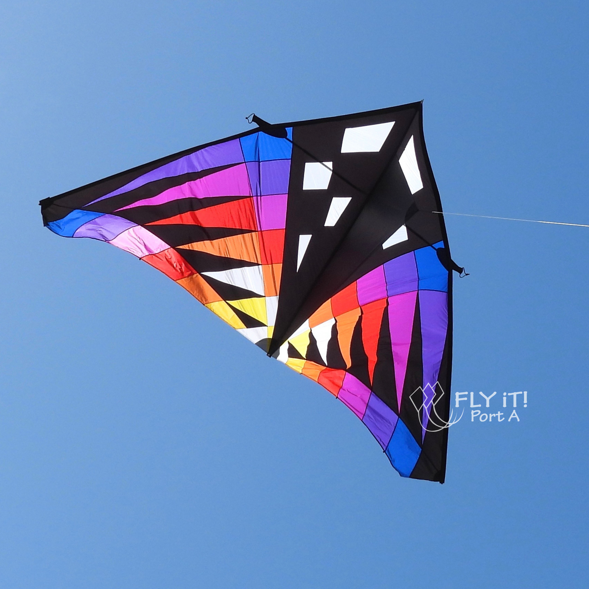 Colorful kite strings against a blue sky with a brand logo.