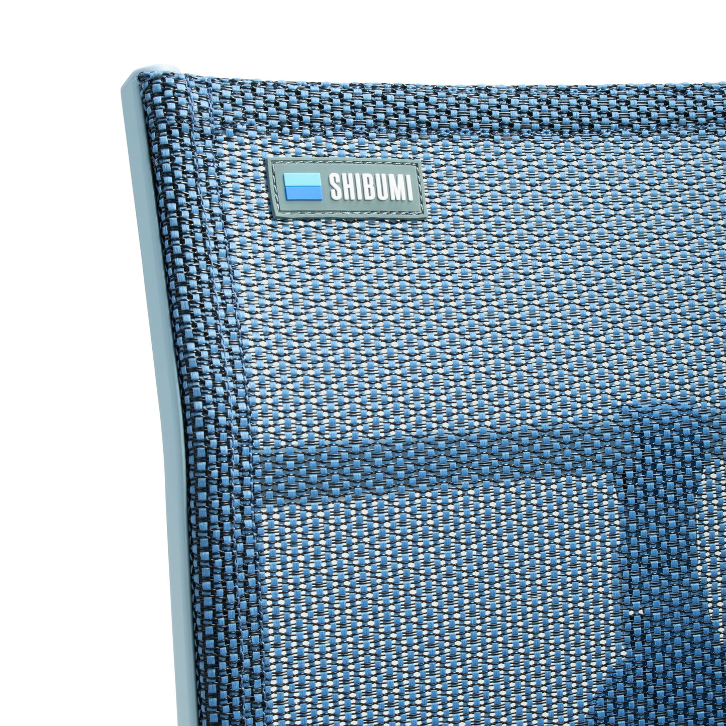 Close-up of a blue textured product with 'SHIBUMI' branding on a white background