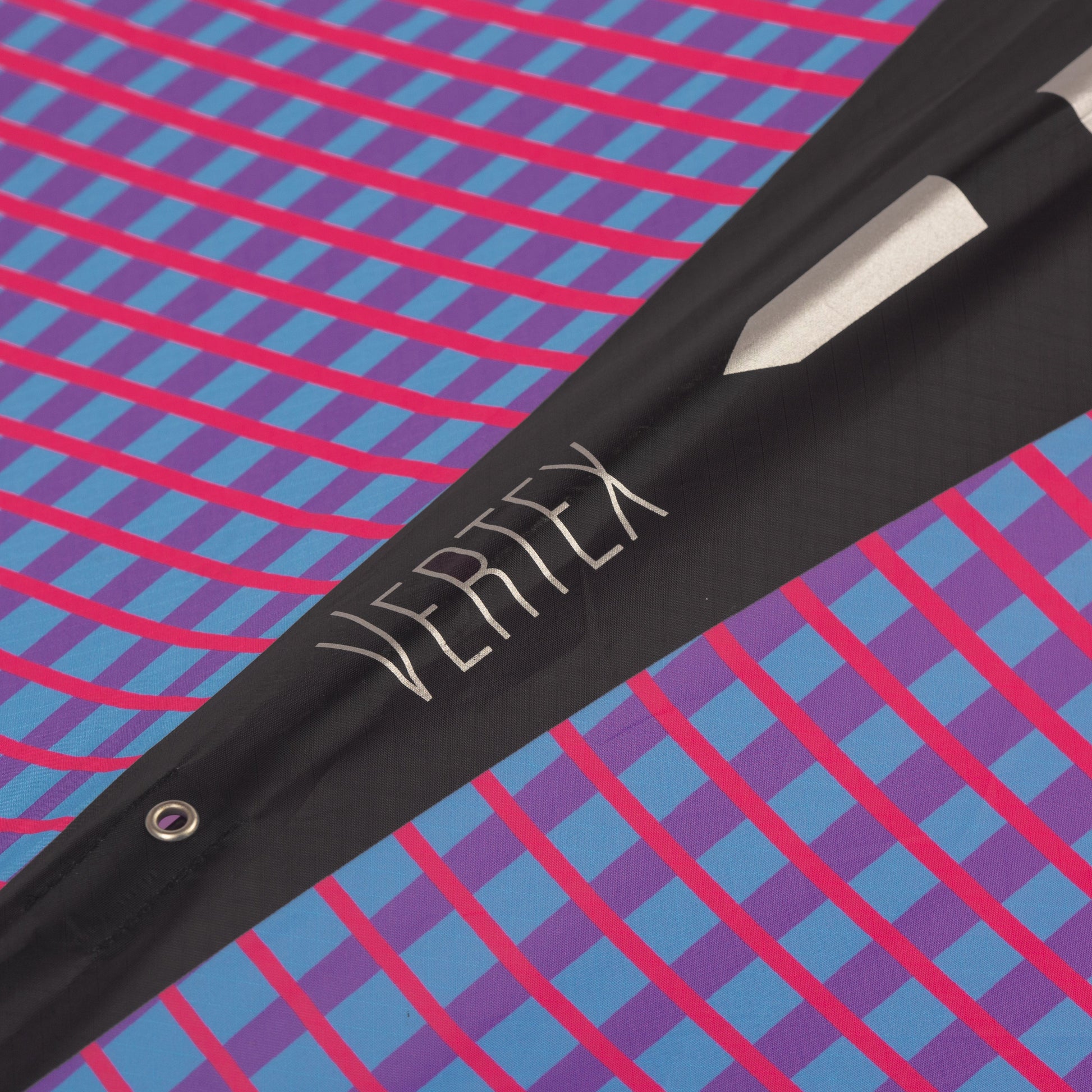 Diamond Kite close up with 'Vertex' branding on a colorful geometric pattern background