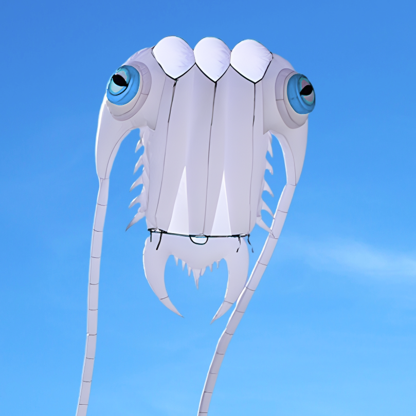 Trilobite-shaped kite against a clear blue sky