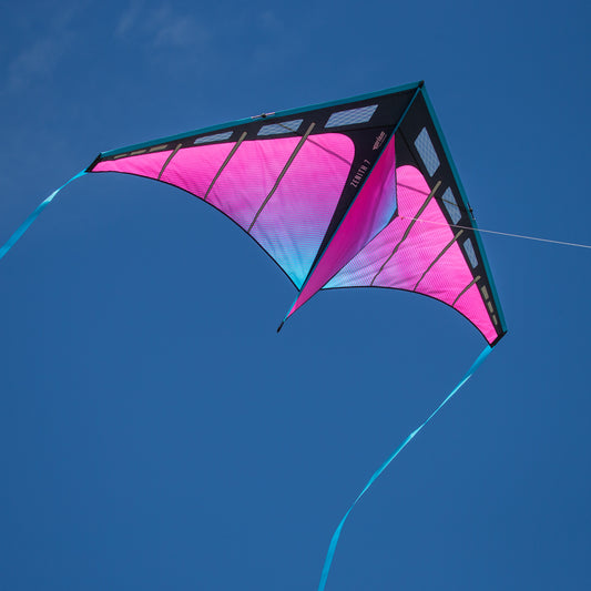 Colorful kite flying against a clear blue sky